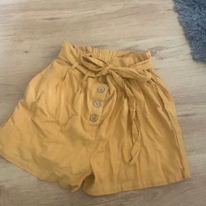 NWT. Mustard yellow shorts size (US 10) Primark
